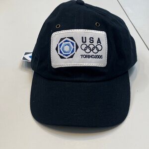 Brand new. Tags attached. Black USA Torino 2006 Cap
